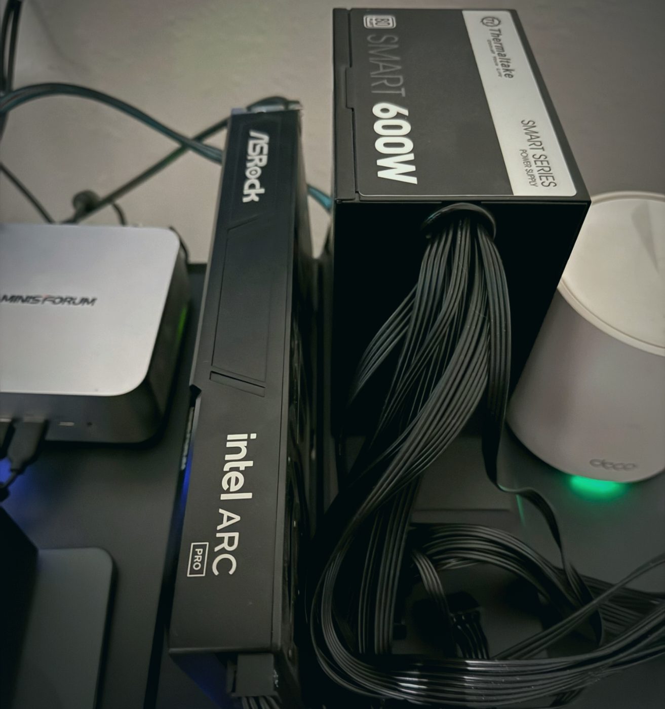 Intel Arc Pro B60 on its OCuLink dock next to the 600W supply
